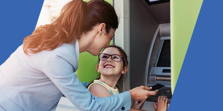 Woman and daughter at an ATM
